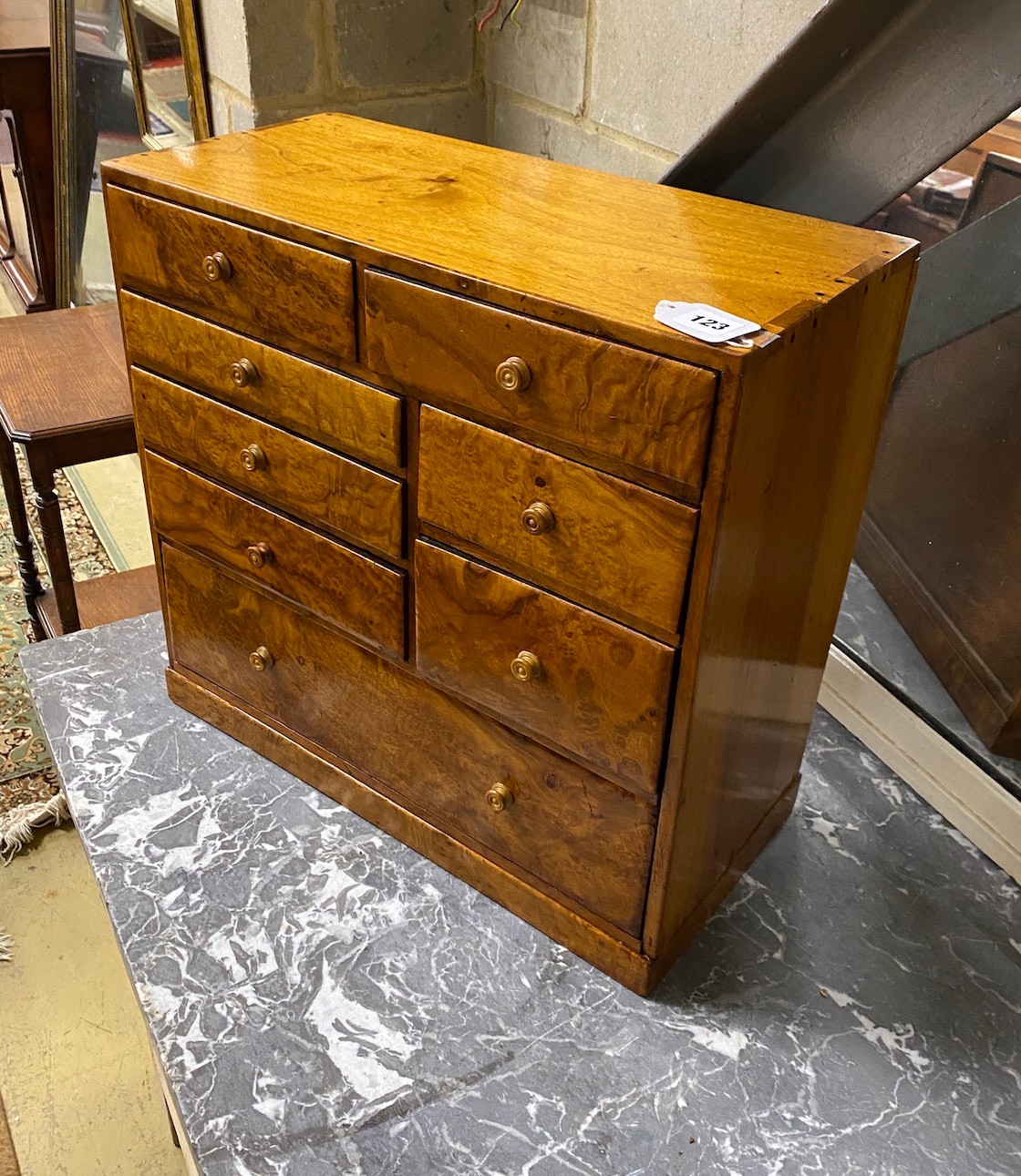 A walnut eight drawer miniature chest, width 51cm, depth 24cm, height 49cm